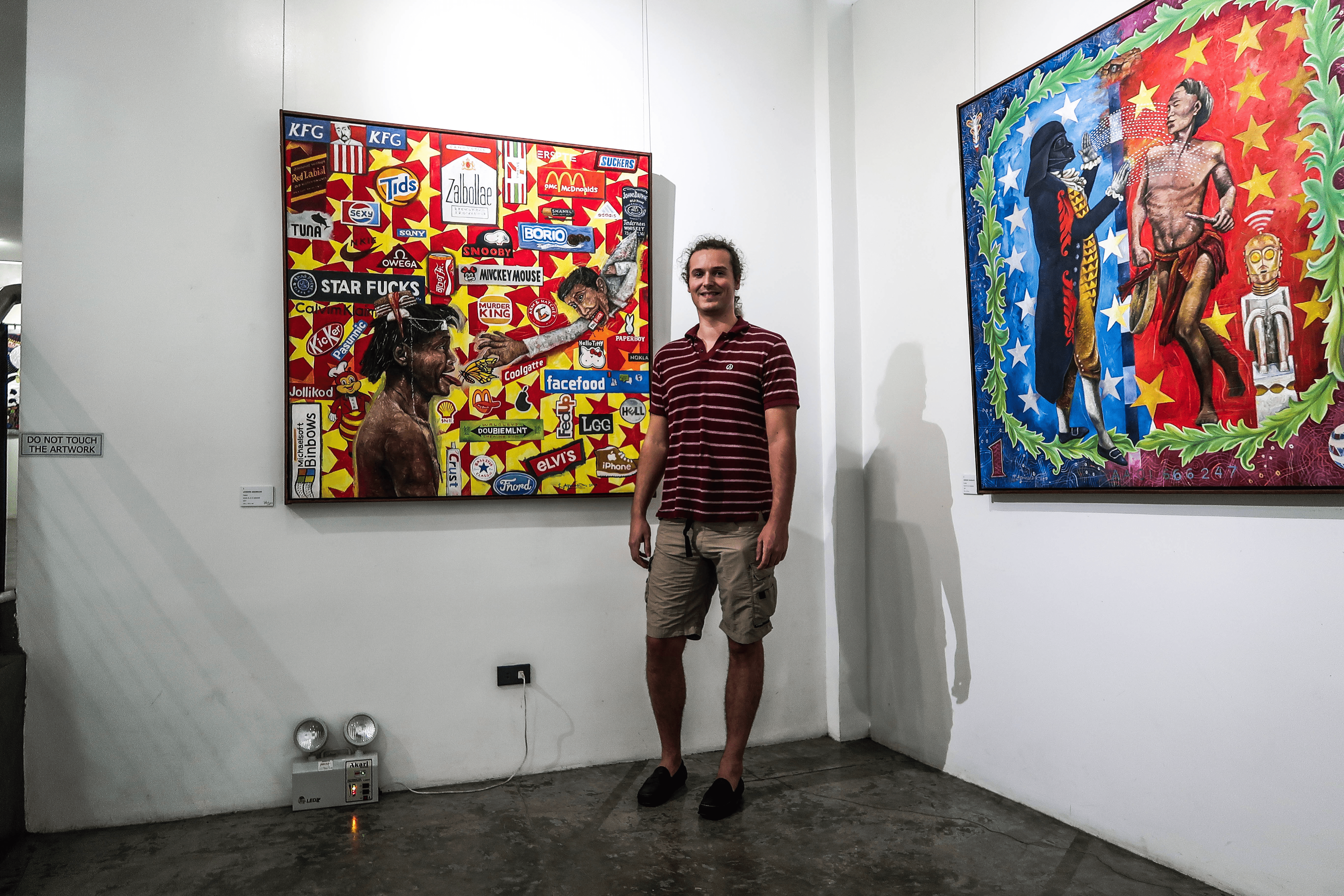 lennythroughparadise posing in the bencab museum baguio city philippines in front of an artwork